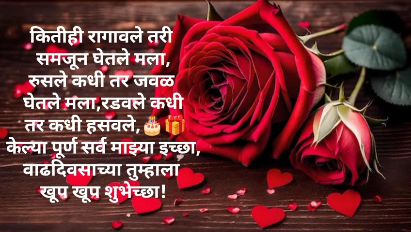 Red roses and candles on wooden surface